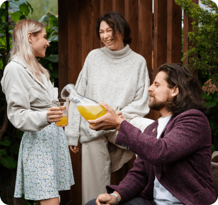 Friends sharing a drink outdoors